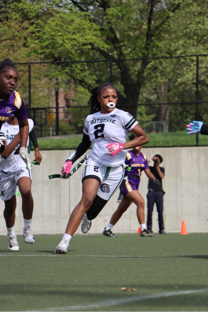 Houlematu, #2, competing in girls flag football